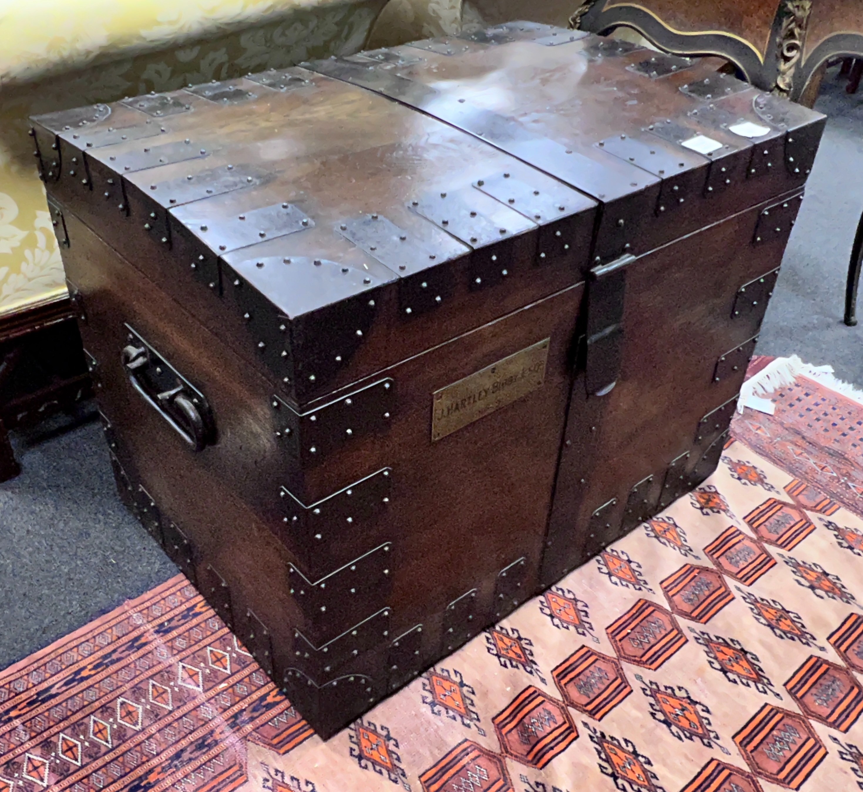 A Victorian iron bound oak silver chest, the engraved brass plaque marked J. Hartley Bibby Esq No. 3, bears interior Goldsmiths & Silversmiths ivory plaques, width 81cm, depth 56cm, height 63cm